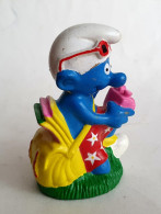 FIGURINE BOUCHON PRIME BIP 1996 SCHTROUMPF PHOTOGRAPHE APPAREIL PHOTO ROSE - Smurfs