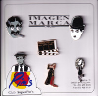 ESTUCHE CON 6 PINS ESMALTADOS DE TEMA CINE - CHARLOT-GROUCHO MARX-RITA HAYWORTH-HAROLD LLOYD, ETC - Kino