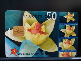 T-270 - PORTUGAL TELECARD, PHONECARD, FLOWER, FLEUR, CHILDREN, ENFANT - Portugal