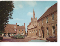 THE STOCKS AND CHURCH - OAKHAM - RUTLAND WITH VARIOUS VINTAGE CARS - MORRIS MINOR - FORD CAPRI ETC - Rutland