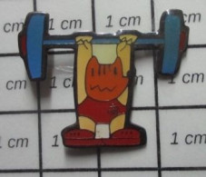 617 Pin's Pins / Beau Et Rare / SPORTS / HALTEROPHILIE JEUX OLYMPIQUES 1992 BARCELONE MASCOTTE COBI - Pesistica