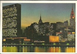 New York City (N.Y., USA) United Nations Building With Empire State Building And Chrysler Building At Night - Chrysler Building