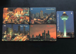 Singapore Telecom Singtel GPT Phonecard, Singapore In The Night, Set Of 5 Used Cards Including One $50 Card - Singapour