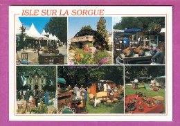 CPM ISLE SUR LA SORGUE 84 - L'Isle Sur Sorgue La Brocante Vide Grenier Vieux Objet Vendeur Roue A Eau - L'Isle Sur Sorgue