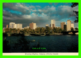 CALGARY, ALBERTA - EVENING SKYLINE - SUNSET GLOW ACROSS BOW RIVER - MAJESTIC - UNITED NEWS - - Calgary