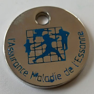 Jeton De Caddie - Assurances - L'ASSURANCE MALADIE DE L'ESSONNE - La Sécu A 50 Ans - Une Grande  Idée. .En Métal - (1) - - Trolley Token/Shopping Trolley Chip