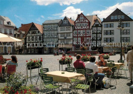 73214181 Butzbach Marktplatz Strassencafes Brunnen Fachwerkhaeuser Altstadt Butz - Butzbach