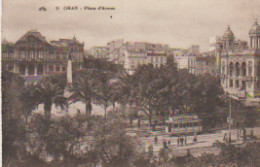 ORAN. Place D'Armes (Tramway + Pub Rhum LUCETA / Panneau "Epicerie Lyonnaise"/ Monument Aux Morts ) ) - Oran