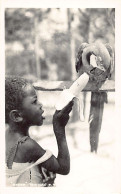 Trinidad - Young Child And Macaw Parrot - REAL PHOTO BY W. C. Rosa & Co. Ltd. - Trinidad