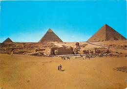 Egypte - Gizeh - Giza - Pyramids And Sphinx - Les Pyramides Et Le Sphinx - Voir Timbre - CPM - Voir Scans Recto-Verso - Gizeh