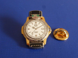 Pin's Montre Tag Heuer - Bracelet Noir Base Argentée - Arthus Bertrand (AA29) - Arthus Bertrand