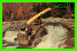 POINTE AU CHÊNE, QUÉBEC - HUNTERS PORTAGE THEIR CANOE OVER THE ROCKS - PHOTO BY OZZIE SWEET - DEXTER PRESS - - Autres & Non Classés