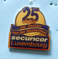 Pin's 25 Joër Securicor Luxembourg - Autres & Non Classés