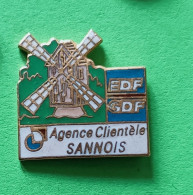 Pin's EDF-GDF Agence Clientéle Sannois Moulin - EDF GDF