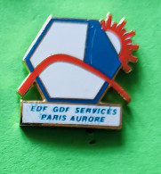 Pin's EDF-GDF Services Paris Aurore.(rayure Sur Le Bleu) - EDF GDF