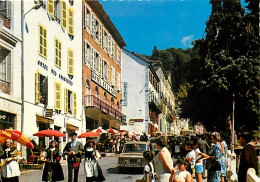 64 - Eaux Bonnes - Le Centre. Les Hôtels - Automobiles - Folklore - Carte Neuve - CPM - Voir Scans Recto-Verso - Eaux Bonnes