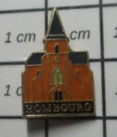 713B Pin's Pins / Beau Et Rare : VILLES / EGLISE HOMBOURG LA REINE ? - Steden