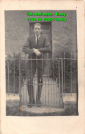 R405716 Man In Suit Standing Near At The Gates - World