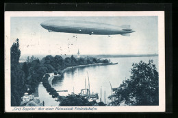 AK Friedrichshafen A. B., Luftschiff LZ127 Graf Zeppelin über Seiner Heimatstadt  - Dirigeables