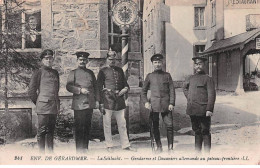 88 - GERARDMER - SAN24954 - La Schlucht - Gendarme Et Douanier Allemand Au Poteau Frontière - Saint Die