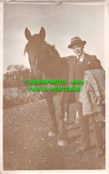 R477947 A Man In A Suit With A Horse. Postcard - Mondo