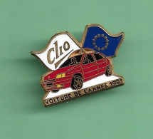 Pin's *** RENAULT CLIO VOITURE DE L'ANNEE *** Signe Arthus BERTRAND *** WW04 (21-1) - Arthus Bertrand