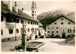 13729474 Zuoz GR Dorfplatz Mit Brunnen Und Kirche Zuoz GR - Andere & Zonder Classificatie