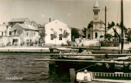 73851459 Pakostane Croatia Im Hafen Blick Zur Kirche  - Croatia