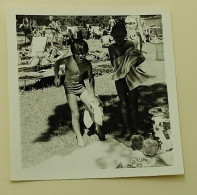 Toweling Off On The Beach After Swimming - Anonymous Persons