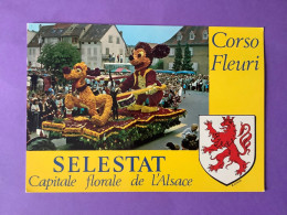 67     CPSM  SELESTAT     Capitale Florale De L’Alsace   Corso Fleuri Mickey….   Très Bon état - Selestat
