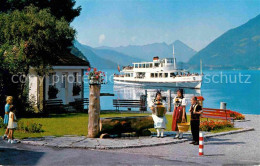 12754778 Iseltwald Am Brienzersee Berner Trachten Und MS Interlaken Alpen Iseltw - Autres & Non Classés