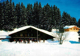 12678602 Braunwald GL Berghaus Hahnenbuehl Und Berghaus Wettstein Im Winter Brau - Autres & Non Classés