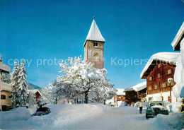 12647671 Klosters GR Dorfpartie Im Winter St Jakobskirche Altes Rathaus Klosters - Autres & Non Classés