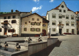 12456798 Scuol Tarasp Vulpera Dorfplatz Brunnen Scuol - Sonstige & Ohne Zuordnung
