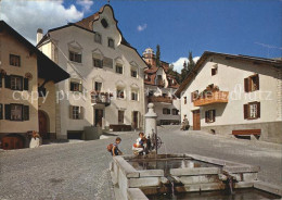 12456793 Scuol Tarasp Vulpera Dorfplatz Buegl Grond Dorfbrunnen Scuol - Autres & Non Classés