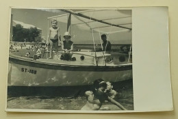 Two Boys On A Boat At Sea - Anonymous Persons