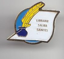 Pin's Librairie Saliba Saintes En Charente Maritime Dpt 17 Encrier Et Plume Réf 1807 - Ciudades
