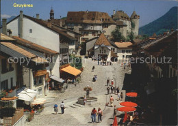 11979644 Gruyeres FR Rue Pittoresque Avec Chateau Gruyeres - Autres & Non Classés