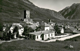 13663845 Hospental Ortansicht Mit Kirche Und Burgruine Alpen Hospental - Sonstige & Ohne Zuordnung