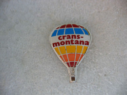 Pin's Montgolfiere Avec La Pub De La Ville Suisse CRANS-MONTANA - Montgolfières