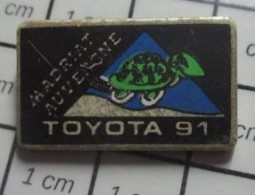3517 Pin's Pins / Beau Et Rare / AUTOMOBILES / TOYOTA 91 TORTUE MADRIAT AUVERGNE Par JCC - Toyota