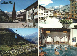 11875290 Saas-Fee Kirche Gondelbahn Dorfplatz Hallenbad Saas-Fee - Autres & Non Classés