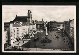 AK Linz A. D. D., Platz D. 12. November Mit Geschäften Und Denkmal, Strassenbahn  - Tramways