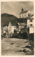 13335355 Andermatt Haeuserpartie Am Fluss Blick Zur Mariahilf Kapelle Andermatt - Autres & Non Classés