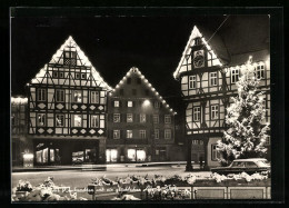 AK Urach /Württ., Strassenpartie Mit Geschäften Und Weihnachtsbaum Bei Nacht, Neujahrsgruss  - Bad Urach