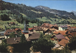 11871571 Gstaad Teilansicht Kirche Gstaad - Sonstige & Ohne Zuordnung