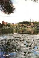 73637467 Ludza Uferpartie Am Fluss Blick Zur Stadt  - Lettonia