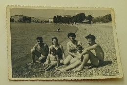 A Little Girl, A Boy, Two Women And Two Men On The Beach - Anonymous Persons