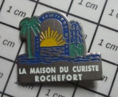 1214D Pin's Pins / Beau Et Rare : MARQUES / ROCHEFORT LA MAISON DU CURISTE - Markennamen