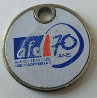 Jeton De Caddie - AFD - AGENCE FRANCAISE DEVELOPPEMENT - 70 ANS - OBJECTIF DEVELOPPEMENT - En Métal - (1) - - Jetons De Caddies